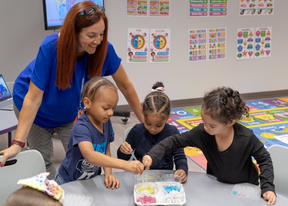 Three students participate in an experiment in the Salvaggio Little Learner's Lab