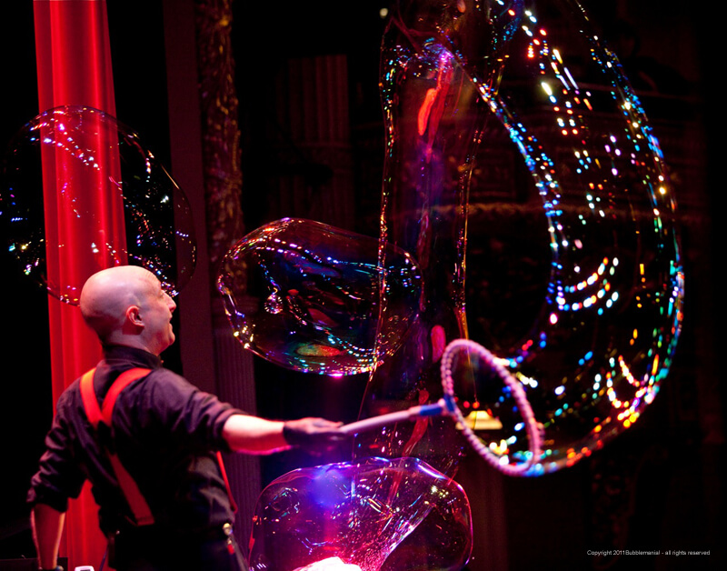 Casey Carle creates large bubbles during the BubbleMania show