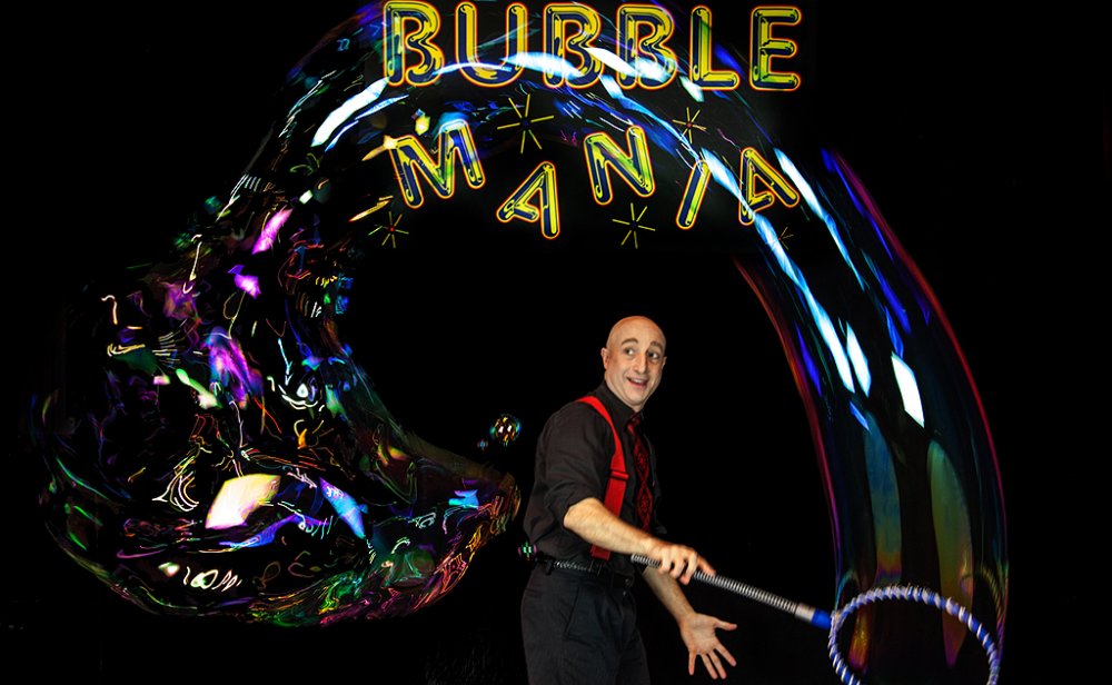 Casey Carle, BubbleMania's show presenter, shows off his bubble skills during the show.